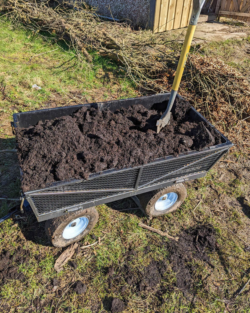 Mixing the compost in my trolly